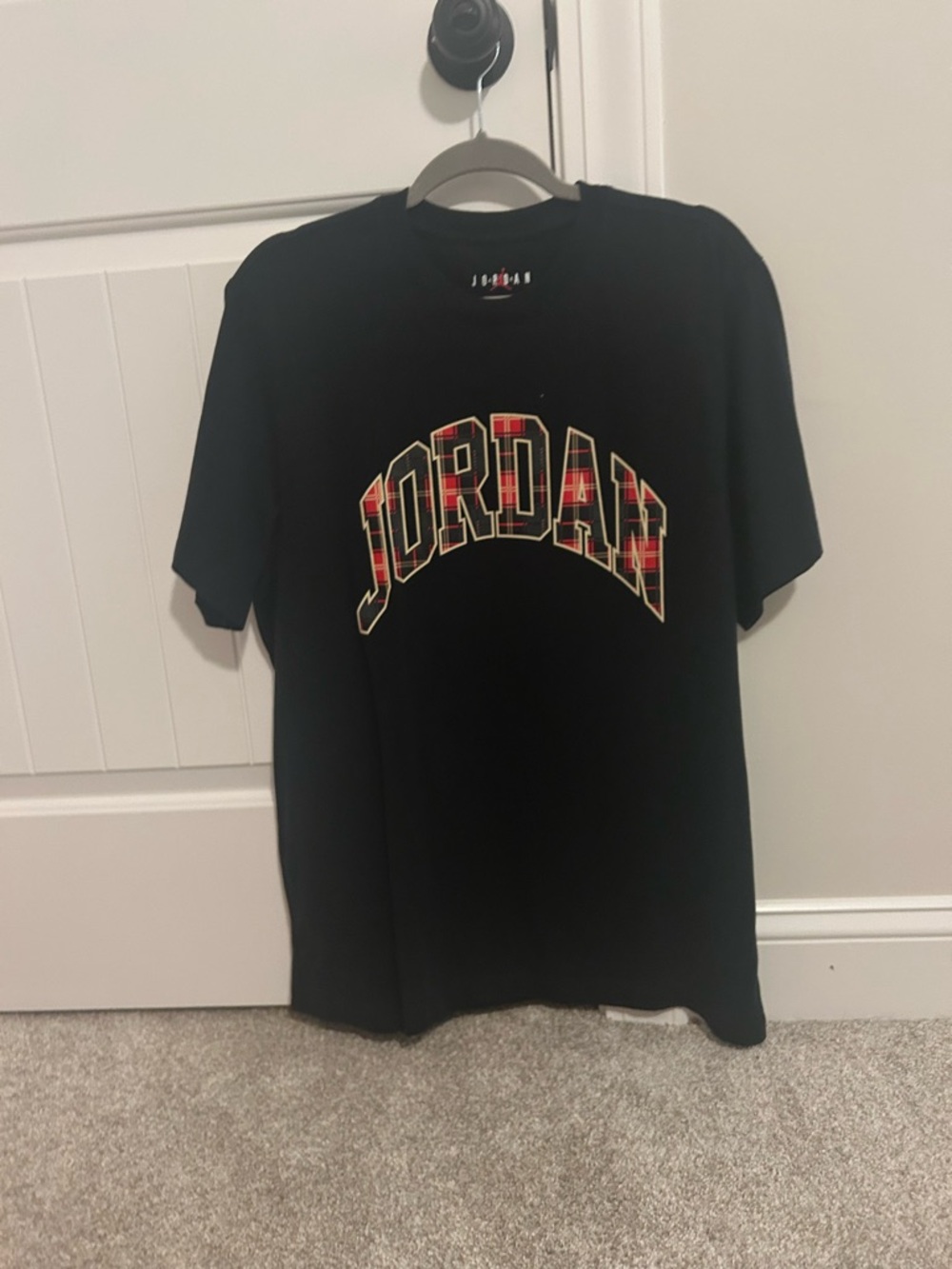 Jordan Black Short-Sleeve Tee with Red Plaid Logo